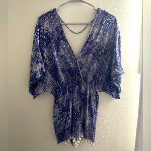 Blue and white patterned romper with Poms